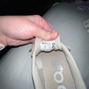 Tan pair of on cloud shoes